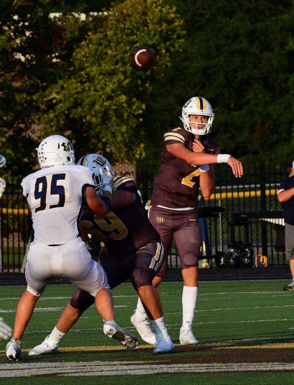 Drew Novak completes a pass over the middle if the line for a Western Brown first down at the Monroe vs. Western Brown football game Friday, Sept. 2.