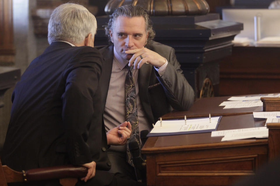 Kansas Senate President Ty Masterson, right, R-Andover, confers with Senate Majority Leader Larry Alley, left, R-Winfield, ahead of a Senate vote on overriding Democratic Gov. Laura Kelly's veto of a bill banning transgender athletes from girl's and women's sports, Wednesday, April 5, 2023, at the Statehouse in Topeka, Kansas. The measure is among several hundred that Republican lawmakers across the U.S. are pursuing. (AP Photo/John Hanna)