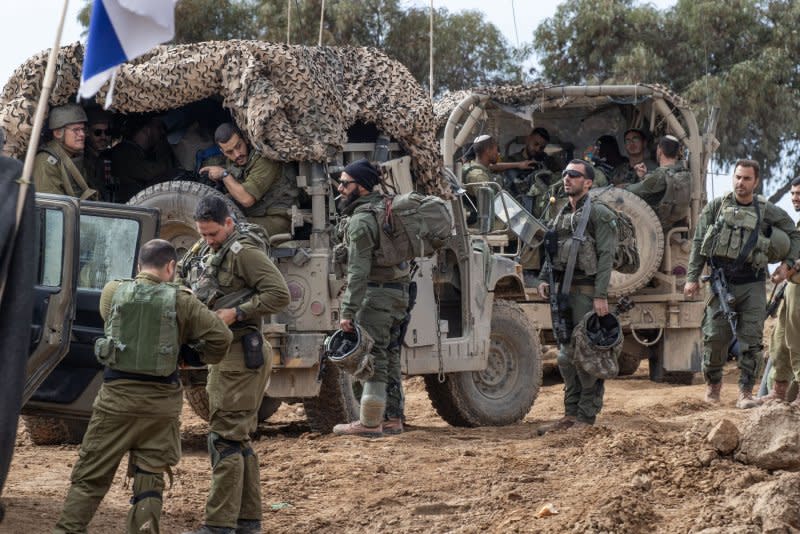 Israeli infantry soldiers board Humvees in a staging area in southern Israel as they move back into the Gaza Strip on Tuesday. Photo by Jim Hollander/UPI