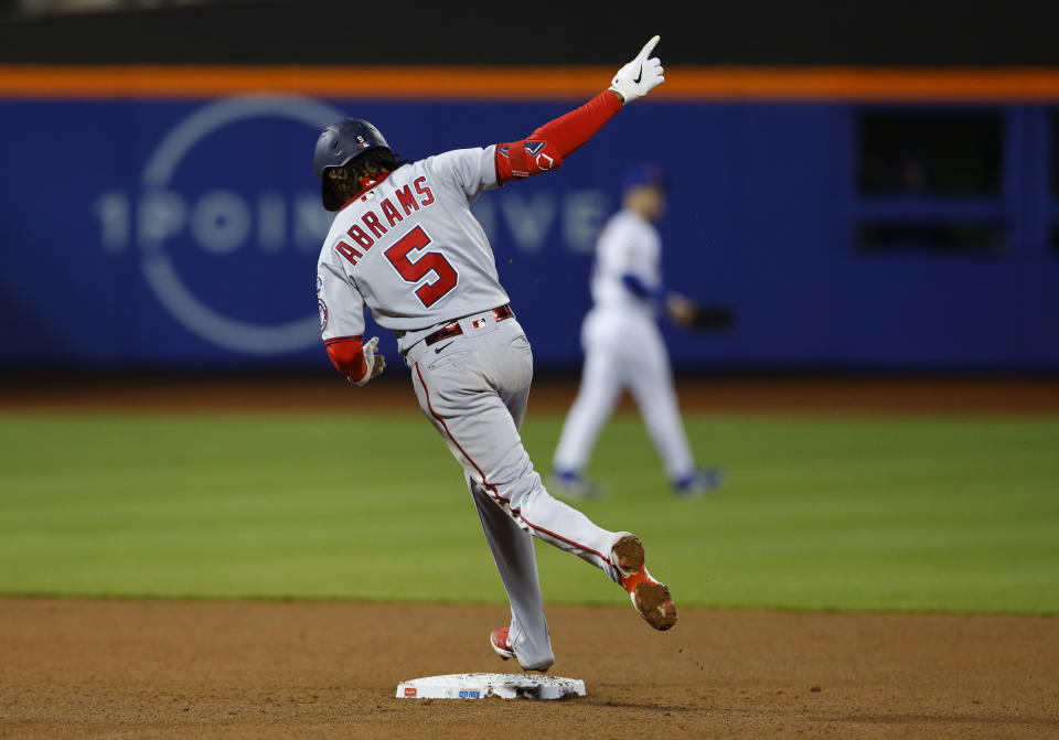 Washington Nationals' CJ Abrams gestures after hitting a grand slam against the New York Mets during the eighth inning of a baseball game Thursday, April 27, 2023, in New York. (AP Photo/Noah K. Murray)