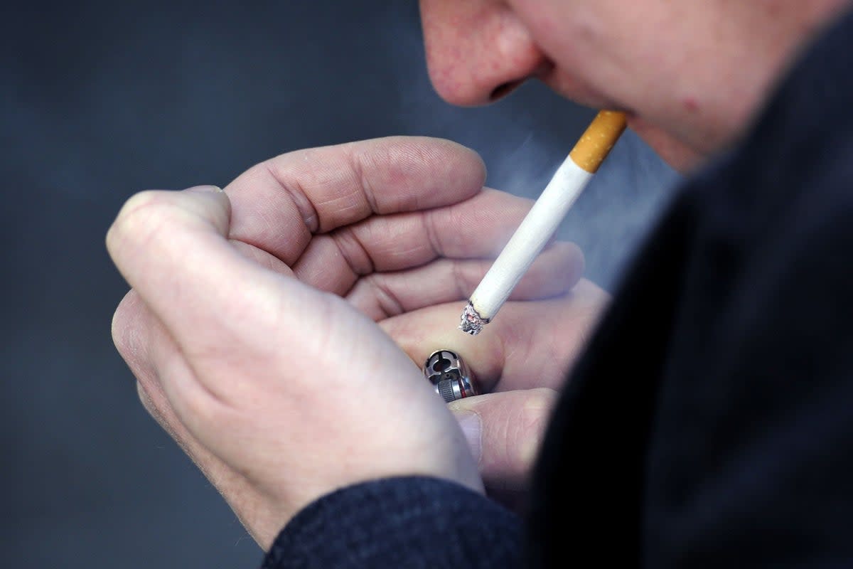 A person smoking a cigarette (PA Wire)