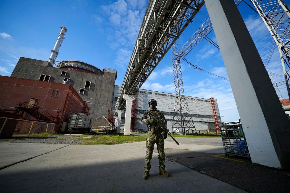 Russian soldier outside the Zaporizhzhia nuclear power plant (Associated Press)