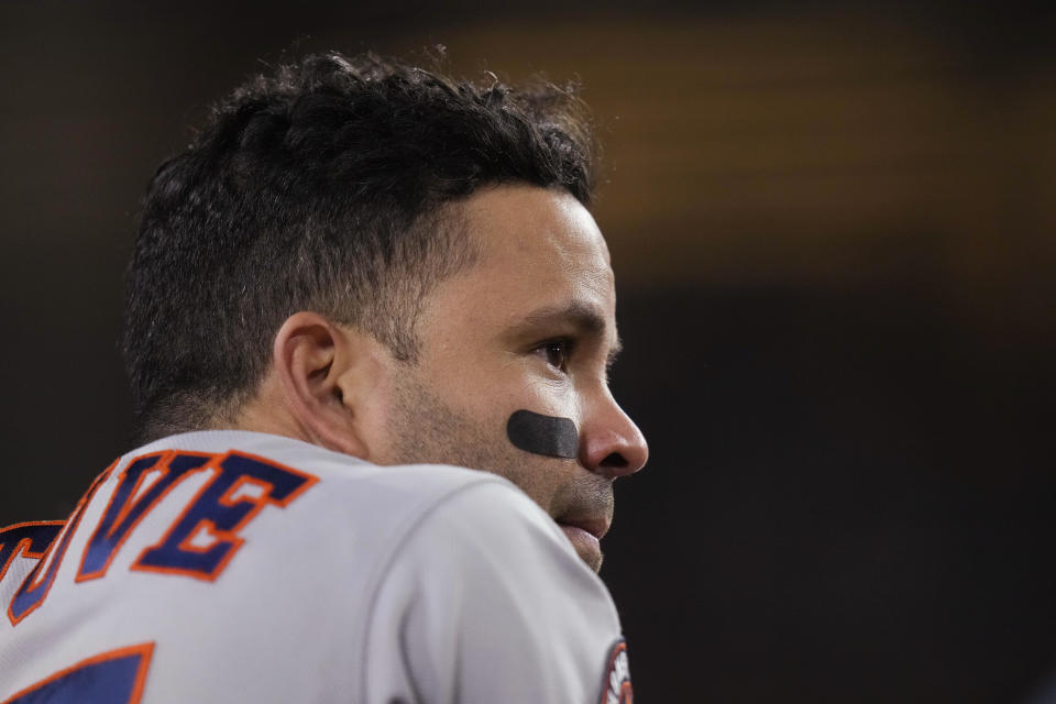 Houston Astros' Jose Altuve watches from the dugout during the ninth inning of the team's baseball game against the Los Angeles Dodgers on Friday, June 23, 2023, in Los Angeles. (AP Photo/Jae C. Hong)