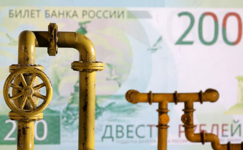 FILE PHOTO: Illustration shows natural gas pipeline and Russian rouble banknote