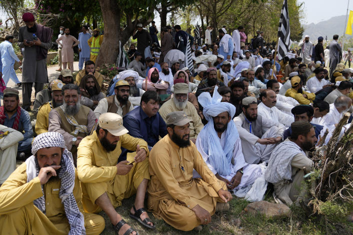 Supporters of Pakistan Democratic Movement, an alliance of the ruling political parties, take part in a rally outside the Supreme Court in Islamabad, Pakistan, Monday, May 15, 2023. Convoys of buses and vehicles filled with Pakistani pro-government supporters are flooding the main road leading to the country's capital on Monday to protest the release of former Prime Minister Imran Khan. (AP Photo/Anjum Naveed)