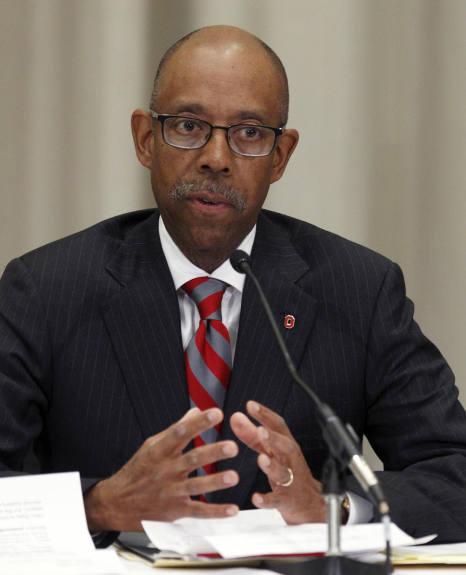 Dr. Michael Drake, the incoming president at Ohio State University, talks during the Ohio State University board meeting after he was named president during the board meeting Wednesday, Jan. 30, 2014. (AP Photo/Paul Vernon)
