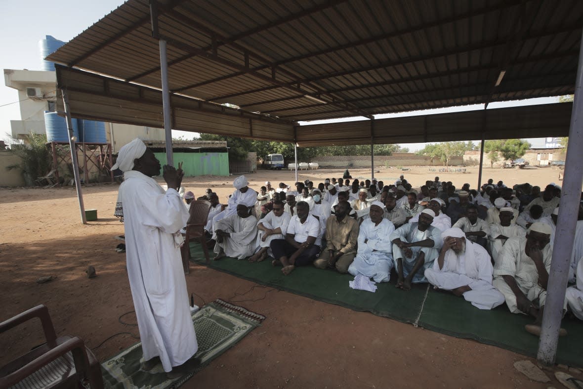 People attend Eid al-Firtr prayer in Khartoum, Sudan, Friday, April 21, 2023. (AP Photo/Marwan Ali)