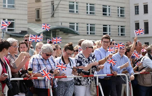 People were waving British flags. Photo: Getty