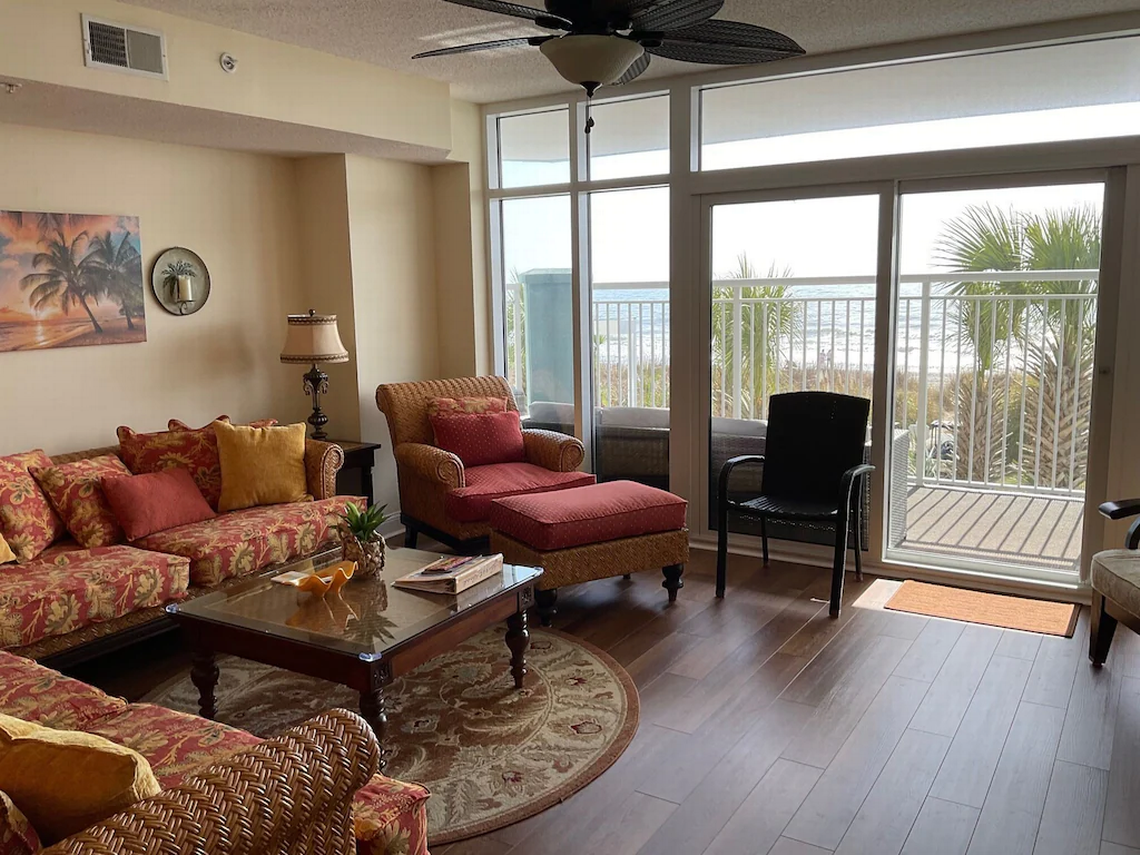 Living room at Ocean Blue 202 condo in Central Myrtle Beach. Screenshot of listing. January 5, 2022.