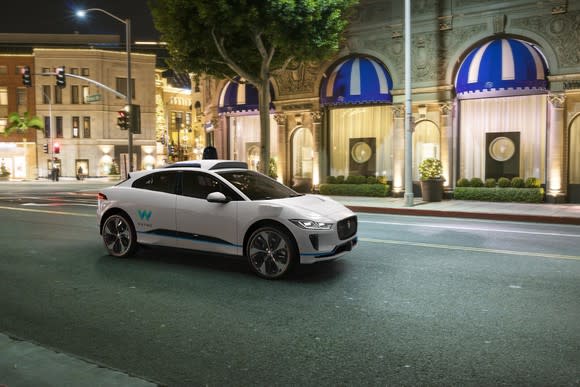 Jaguar car with Waymo self-driving sensors.