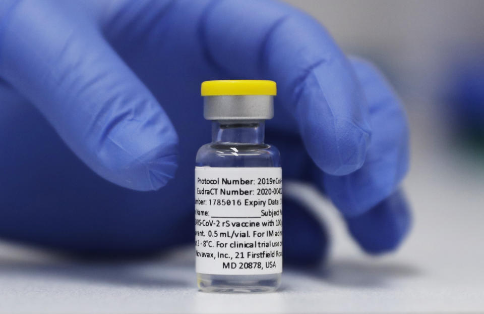 FILE - A vial of the Phase 3 Novavax coronavirus vaccine prepared for use in a trial at St. George's University hospital in London, Oct. 7, 2020. The Novavax COVID-19 vaccine that could soon win federal approval may offer a boost for the U.S. military: an opportunity to get shots into some of the thousands of service members who have refused the vaccine for religious reasons. (AP Photo/Alastair Grant, File)
