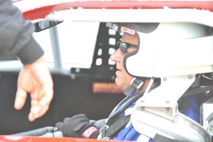 Dispatch sports reporter Mike Duprez drives a racecar during a NASCAR Experience event.