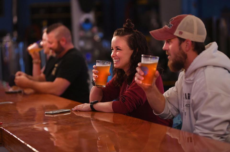 Jeremy and Cortney Burkett enjoy a beer at Ciclops Cyderi & Brewery in Spartanburg, Saturday evening, October 10, 2020.
