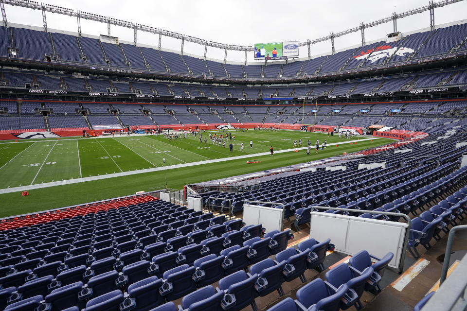 Members of the Denver Broncos take part in drills during an NFL football practice in empty Empower Field at Mile High, Saturday, Aug. 29, 2020, in Denver. (AP Photo/David Zalubowski)