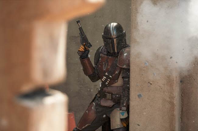 Pedro Pascal takes cover from some heavy firepower in the new Disney+ 'Star Wars' series 'The Mandalorian' (Photo: François Duhamel/Lucasfilm Ltd.)