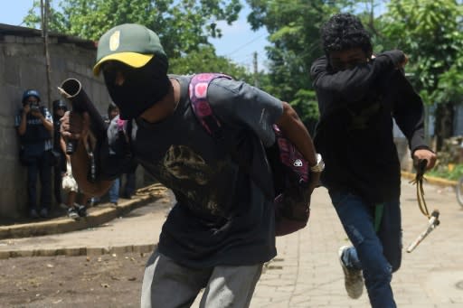 Protesters confront anti-riot police in Masaya on Thursday