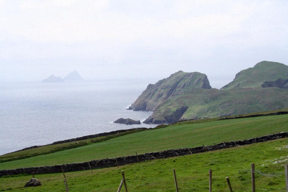 This May 28, 2012 photo shows a view of the Skellig Islands off the coast of the Iveragh Peninsula in County Kerry, Ireland. Ireland is about 300 miles from north to south and a driving trip in the country's western region takes you along hilly, narrow roads with spectacular views ranging from seaside cliffs to verdant farmland. (AP Photo/Jake Coyle)