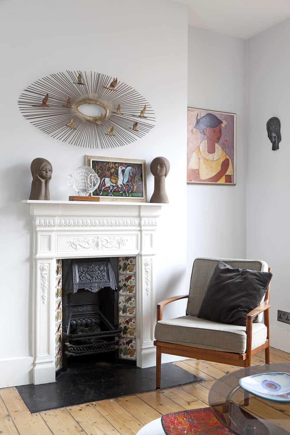 living room with vintage chair and fireplace