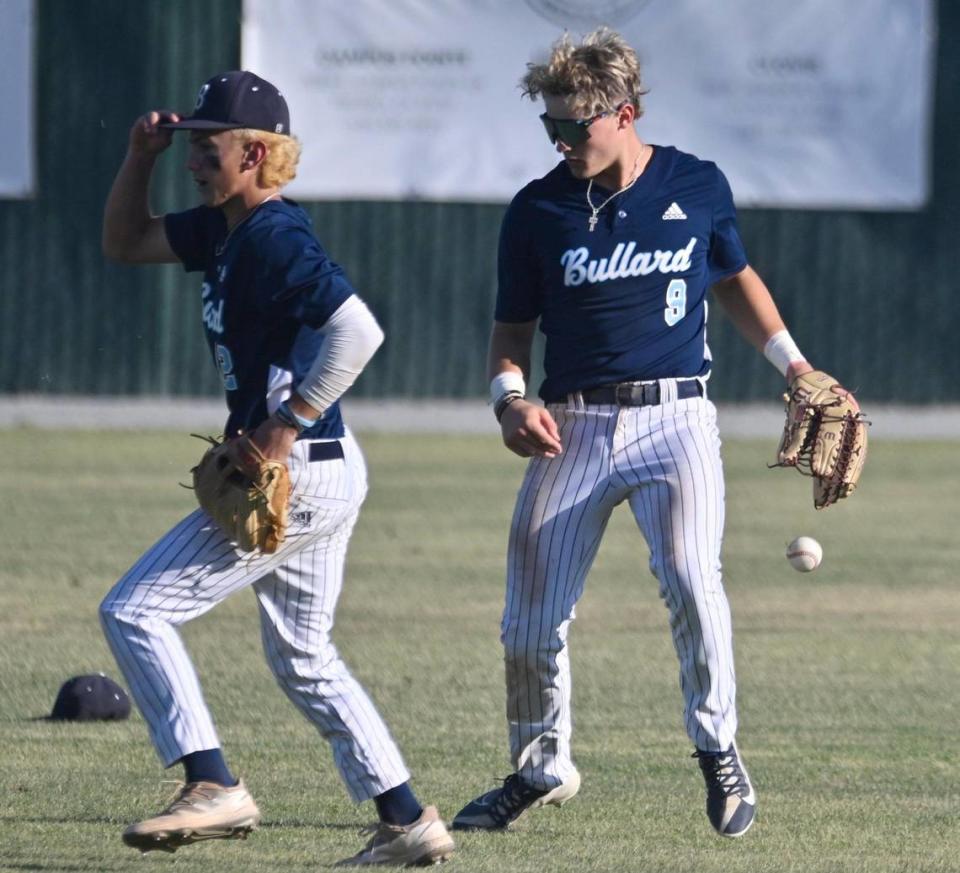 Bullard outfielder Nick Stubblefield, right, drops the ball on a play against Centennial in the Central Section DI baseball quarterfinal Friday, May 19, 2023 in Fresno. Centennial won 6-2.