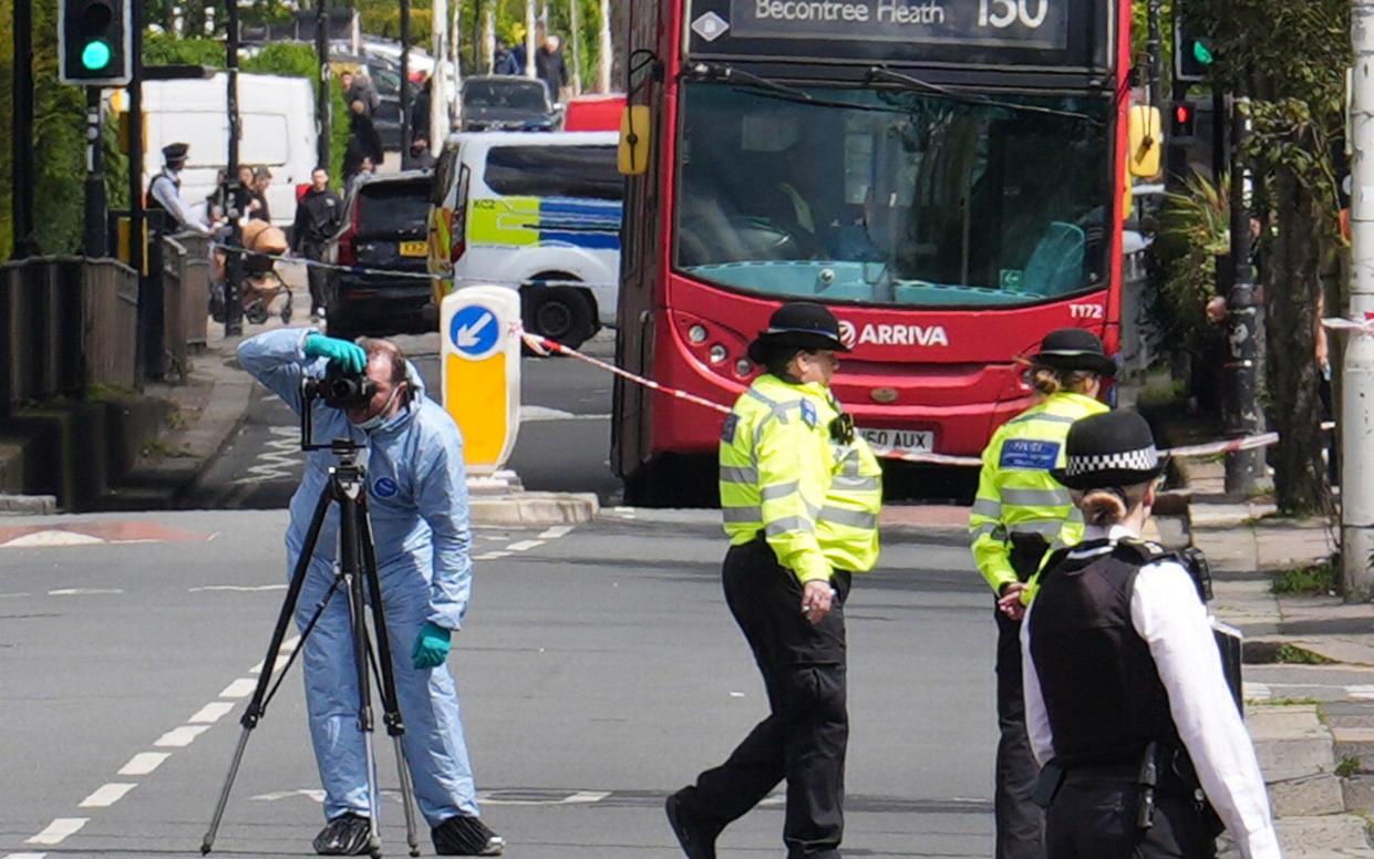 Police and forensic investigators in Hainault, north east London