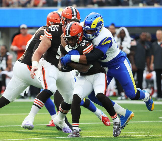 Rams Aaron Donald tackles Cleveland Browns back Jerome Ford.