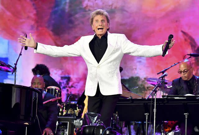 <p>Jeff Kravitz/Getty</p> Barry Manilow performs onstage during We Love NYC: The Homecoming Concert in August 2021