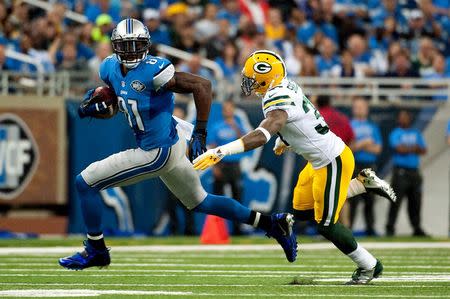 Green Bay Packers cornerback Sam Shields (37) tackles Detroit Lions wide receiver Calvin Johnson (81) during the second quarter at Ford Field. Tim Fuller-USA TODAY Sports