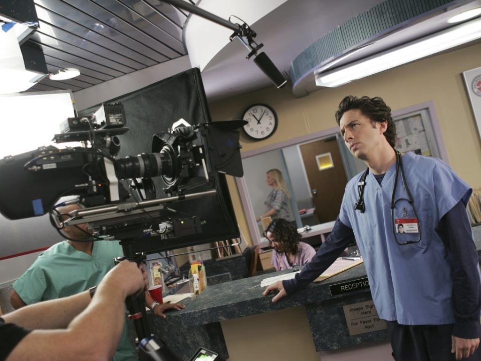 Zach Braff is directed on the set of ‘Scrubs' (NBC-TV/Kobal/Shutterstock)