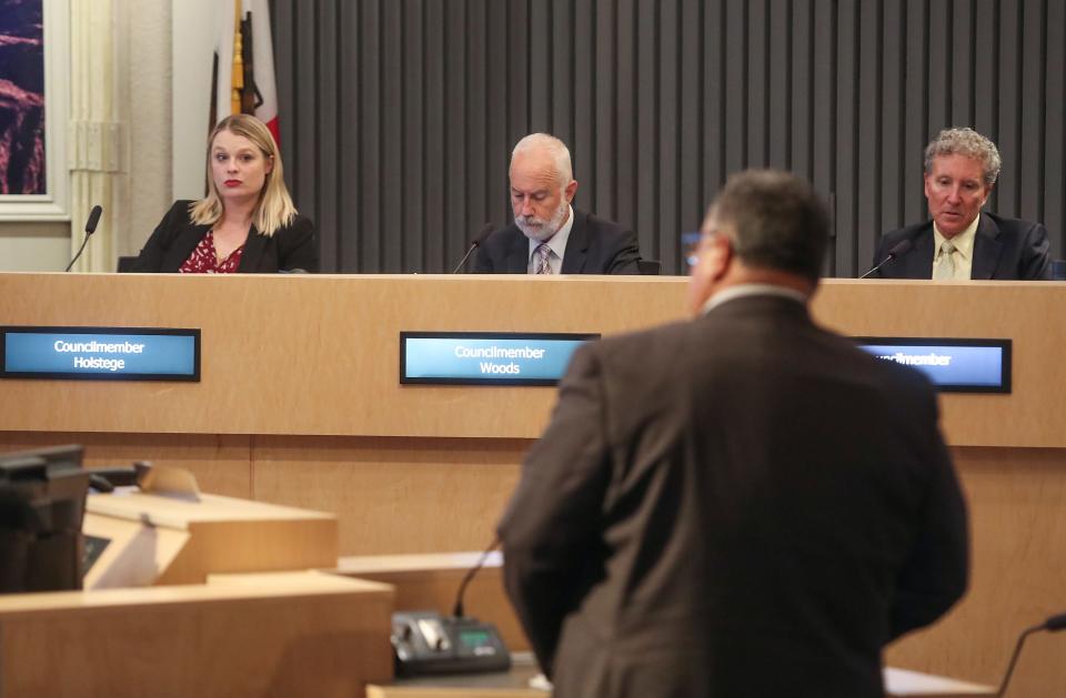 Mac McGinnis, foreground, updates the Palm Springs City Council about the College of the Desert's plans to build a Palm Springs campus during the council meeting at Palm Springs City Hall, April 7, 2022.  In attendance for the city are Christy Holstege, Dennis Woods and Geoff Kors.