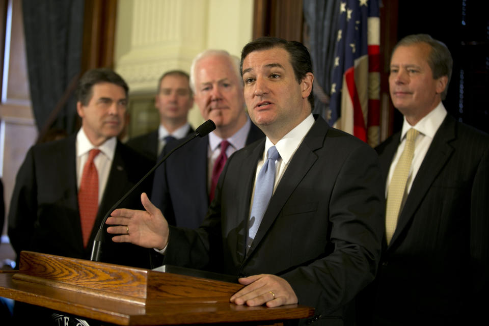 Senator Ted Cruz (R-Texas) speaks during a news conference at the Capitol in Austin, Texas, on Monday, April 1, 2013. Cruz, along with other Republican officials, announced that they believe that Medicaid is a broken system, and that expanding it under the Affordable Care Act is the wrong move for Texas. Shown, from left, are Governor Rick Perry, US Senator John Cornyn and Lt. Gov. David Dewhurst. (AP Photo/Austin American-Statesman, Deborah Cannon)