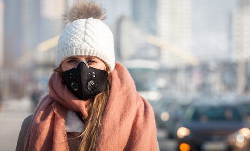 <span class="caption">A mask rated N95 or N99 will best protect against pollution particles. </span> <span class="attribution"><a class="link " href="https://www.shutterstock.com/image-photo/young-woman-wearing-protective-mask-city-1036968928" rel="nofollow noopener" target="_blank" data-ylk="slk:Leszek Glasner/Shutterstock;elm:context_link;itc:0;sec:content-canvas">Leszek Glasner/Shutterstock</a></span>