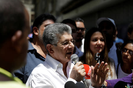 FILE PHOTO: Henry Ramos Allup, lawmaker of the Venezuelan coalition of opposition parties (MUD), speaks during a gathering with opposition supporters in Caracas, Venezuela March 17, 2018. REUTERS/Marco Bello/File Photo