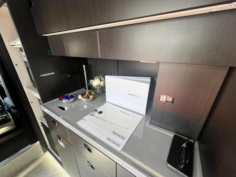 The galley on an Embraer Praetor 600 include brochures and candies