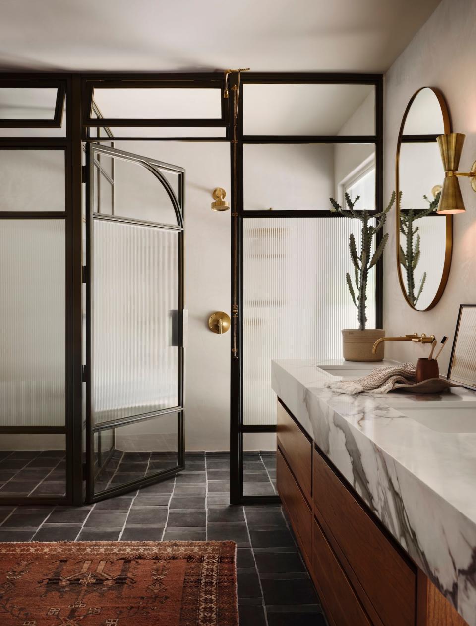 A bathroom with a walk-in shower.