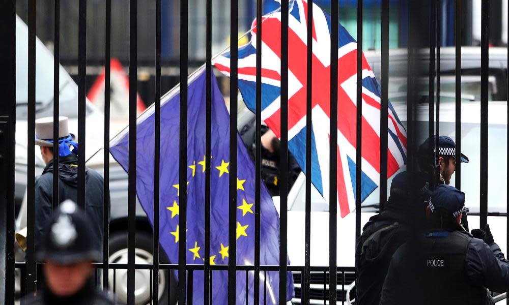 EU and UK flags behind bars in London