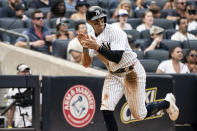 New York Yankees' Tim Locastro celebrates a run during the fourth inning of a baseball game against the Boston Red Sox, Sunday, July 17, 2022, in New York. (AP Photo/Julia Nikhinson)