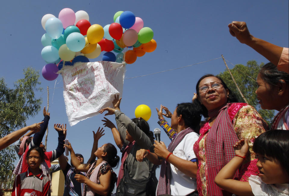 <p>Land activists from the Boeung Chhuk community release balloons to mark International Women’s Day on the outskirts of Phnom Penh, Cambodia, Thursday, March 8, 2018. The community took part in the International Women’s Day celebration, which coincided with the 10th anniversary of their forced eviction. (Photo: Heng Sinith/AP) </p>