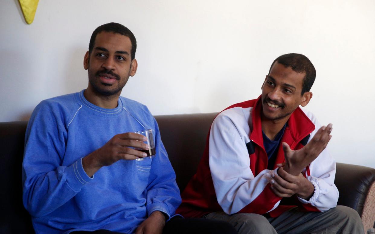 Alexanda Amon Kotey, left, and El Shafee Elsheikh, who were allegedly among four British jihadis who made up a brutal Islamic State cell dubbed "The Beatles," - AP Photo/Hussein Malla