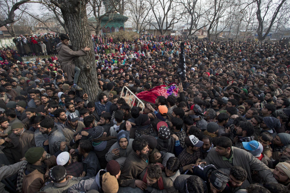 Kashmiri villagers carry the body of Rasik Mir, a local rebel during a joint funeral procession of four rebels in Tral, south of Srinagar, Indian controlled Kashmir, Saturday, Dec. 22, 2018. A gunbattle between Indian troops and Kashmiri rebels early Saturday left six militants dead and triggered a new round of anti-India protests in the disputed Himalayan region. (AP Photo/Dar Yasin)