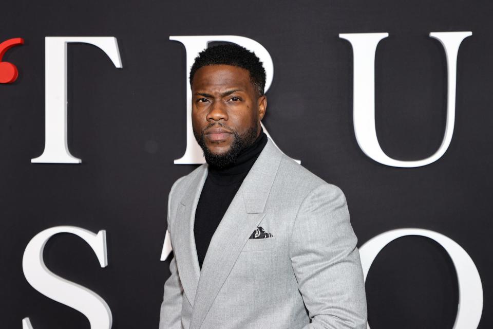 Kevin Hart in a grey suit