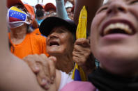 Supporters of opposition leader Freddy Superlano cheer during a demonstration in Barinas, Venezuela, Saturday, Dec. 4, 2021. Superlano, who was leading the race for governor in Barinas State in the recent Nov. 21 regional elections, called for a protest this Saturday after a court ruling ordered new elections in the state and disqualified him from running(AP Photo/Ariana Cubillos)