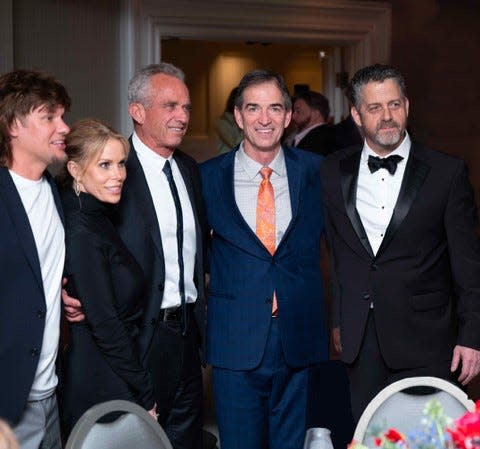 Independent presidential candidate Robert F. Kennedy Jr. (third from left), has big-name supporters including comedian and podcaster Theo Von (far left), Kennedy's wife, actress Cheryl Hines, pro basketball great John Stockton (middle) and publisher Tony Lyons.