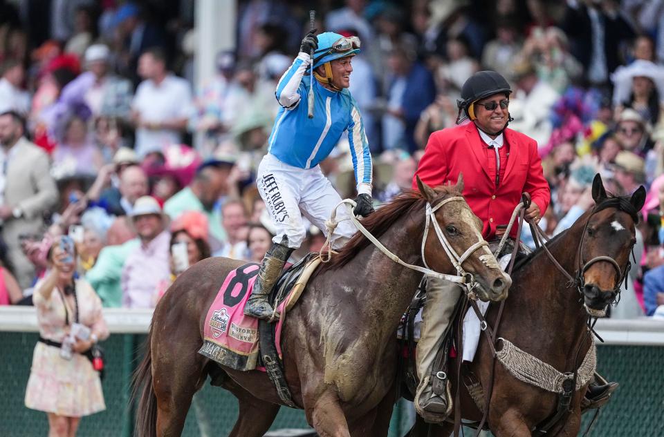 After winning the 149th Kentucky Derby, jockey Javier Castellano celebrates aboard Mage as they are led to the Winner's Circle by outrider Greg Blasi Saturday at Churchill Downs in Louisville, Ky. on May, 6, 2023.
