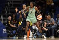 New York Liberty forward Natasha Howard (6) is defended by Dallas Wings forward Kayla Thornton during the first half of a WNBA basketball game in Arlington, Texas, Wednesday, Aug. 10, 2022. (AP Photo/Tony Gutierrez)