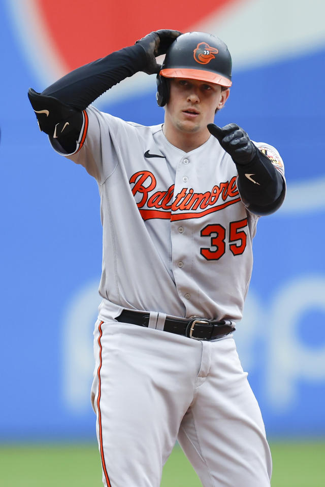 Adley Rutschman of the Baltimore Orioles and family walk during