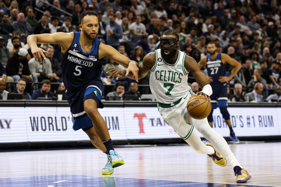 MINNEAPOLIS, MN - MARCH 15: Jaylen Brown #7 of the Boston Celtics drives to the basket while Kyle Anderson #5 of the Minnesota Timberwolves defends in the second quarter of the game at Target Center on March 15, 2023 in Minneapolis, Minnesota. NOTE TO USER: User expressly acknowledges and agrees that, by downloading and or using this Photograph, user is consenting to the terms and conditions of the Getty Images License Agreement. (Photo by David Berding/Getty Images)