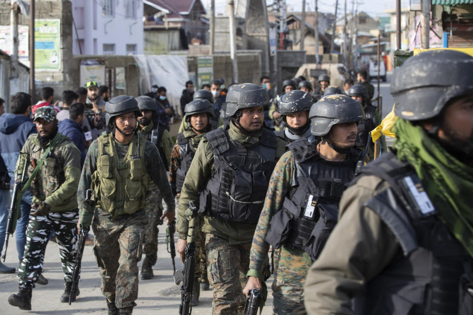 Indian soldier arrive at the site of an attack on the outskirts of Srinagar, Indian controlled Kashmir, Thursday, March 25, 2021. Rebels fighting against Indian rule in disputed Kashmir Thursday attacked a paramilitary patrol, killing two soldiers and injuring two others, an official said. (AP Photo/Mukhtar Khan)