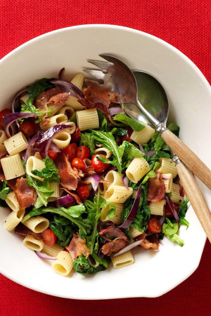 <p>Served as a main or side, this hearty pasta features all the components of the beloved sandwich—just better, with peppery arugula, fresh tomatoes (use chopped medium-size tomatoes if you don't have grape or cherry on hand) and pungent red onion.</p><p><a href="https://www.womansday.com/food-recipes/food-drinks/recipes/a11605/blt-pasta-recipe-122964/" rel="nofollow noopener" target="_blank" data-ylk="slk:Get the BLT Pasta Salad recipe." class="link rapid-noclick-resp"><em>Get the BLT Pasta Salad recipe.</em></a> </p>