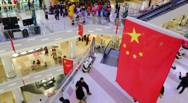 A large shopping mall in the central city is festooned with Chinese flags in celebration of the National Day after the victory against the Covid-19 epidemic.