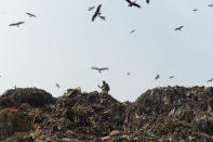 <p>A man sifts through trash at a massive garbage site in New Delhi on September 27, 2016. Polluted air is a “public health emergency”, the World Health Organization said September 27, adding nine out of 10 people globally breathe bad air that is blamed for more than six million deaths a year. And the WHO warned that nearly 90-percent of air pollution-related deaths occur in low and middle-income countries. (Sajjad Hussain/AFP/Getty Images)</p>